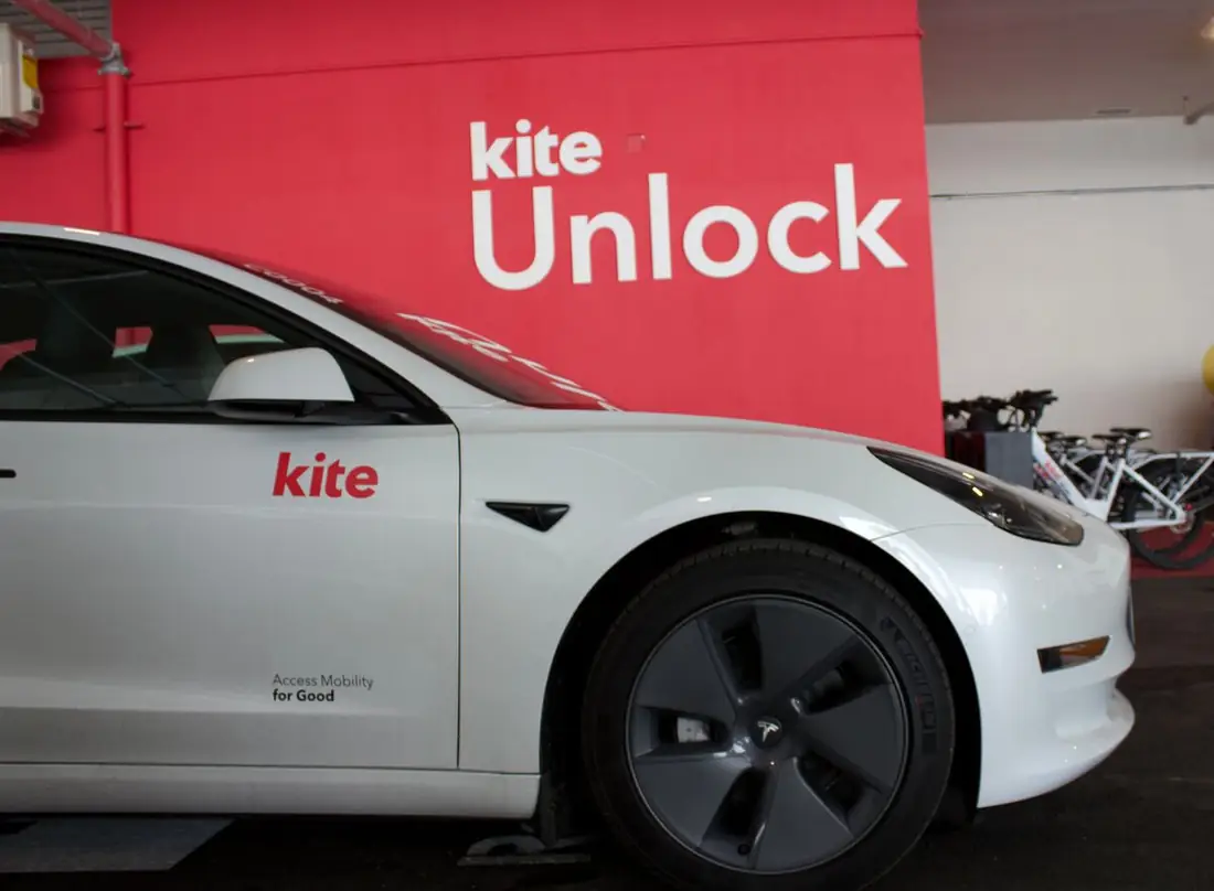 A Kite car parked at the Cherry House hub by the Kite Unlock wall